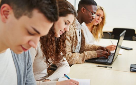 18629535 - many students learning with laptop computer in lecture of university